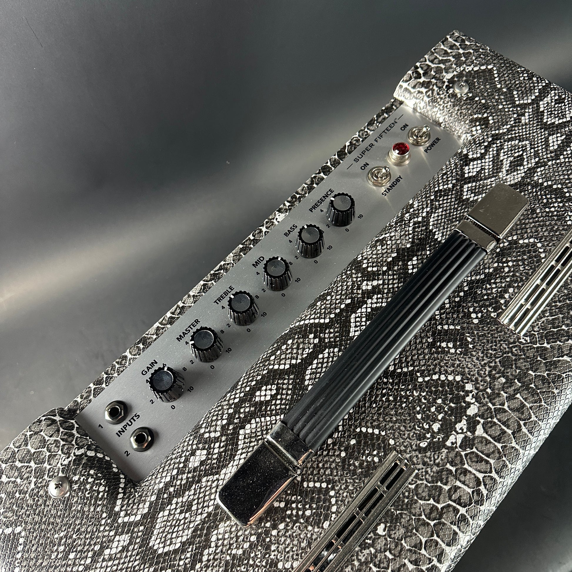 Electronic device with knobs and connectors on a textured surface