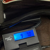 Fender Custom Shop Postmodern Precision Bass RW DLX Closet Classic Ebony Transparent on scale displaying weight.