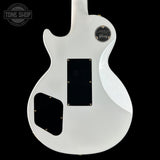 White electric guitar body with 'Tone Shop' logo in the corner