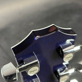 Chip on headstock of Used 2005 Taylor T5-S Flame Blue.