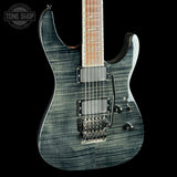 Electric guitar with a blue flame maple top on a black background, featuring the Tone Shop logo.