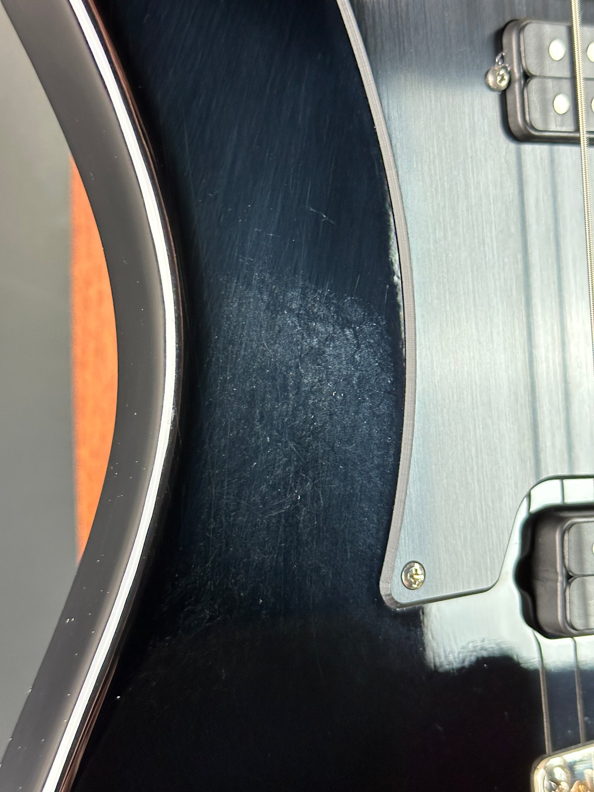 Close-up of a guitar's soundhole and body