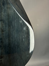 Close-up of a metallic object with reflective surface and visible texture