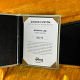 Gibson Custom Certificate of Authenticity for Murphy Lab Heavy Aging on a wooden surface