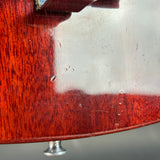 Close-up of a wooden product with a metallic base on a light gray background