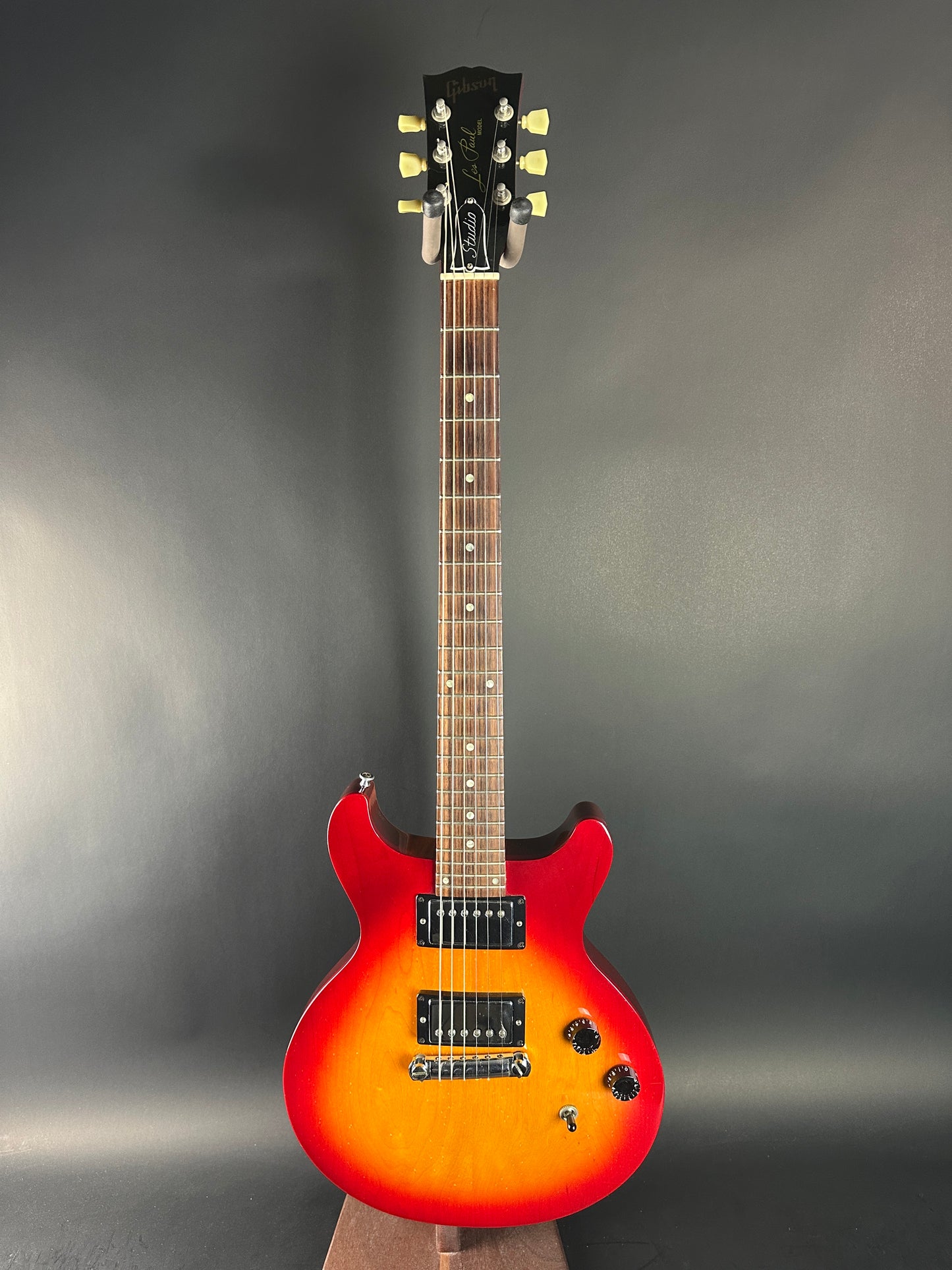 Electric guitar with a sunburst finish on a gray background