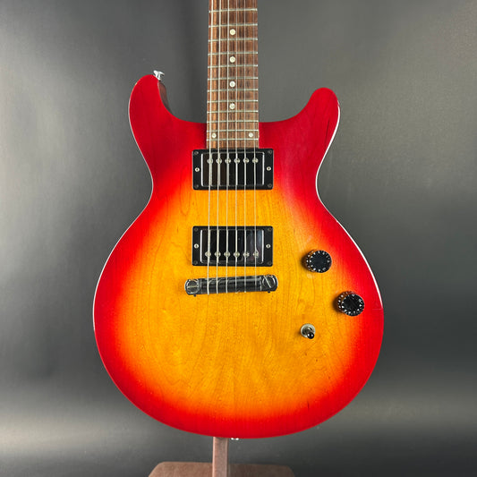 Electric guitar with a sunburst finish on a gray background