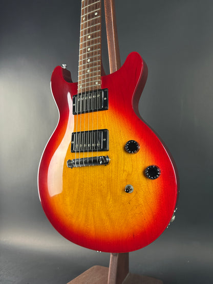 Electric guitar with a sunburst finish on a dark background