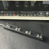 Bogner amplifier with a footswitch on a dark surface