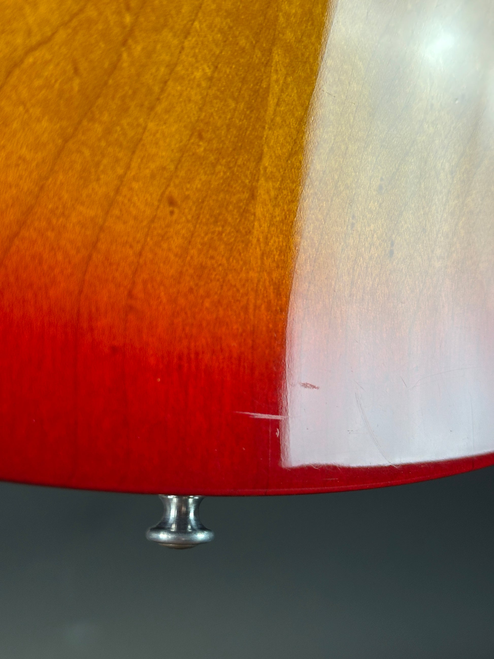 Close-up of a wooden surface with a metal screw