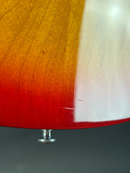 Wear on body of Used 1997 Gibson Les Paul Studio Double Cut Cherry Sunburst.