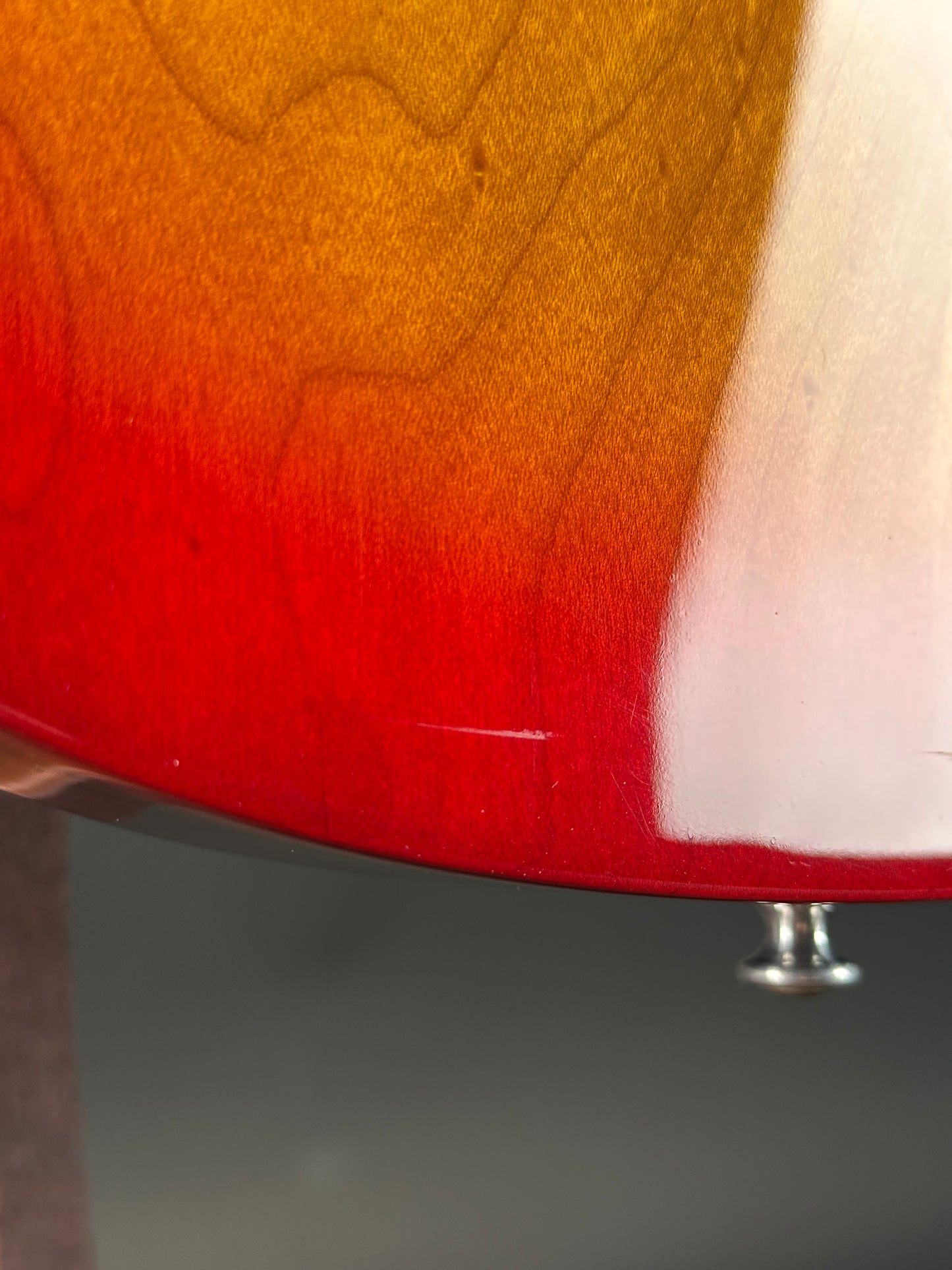 Wear on body of Used 1997 Gibson Les Paul Studio Double Cut Cherry Sunburst.