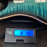 Used PRS 40th Anniversary Custom 24 Limited Edition Sub Zero on scale displaying weight.