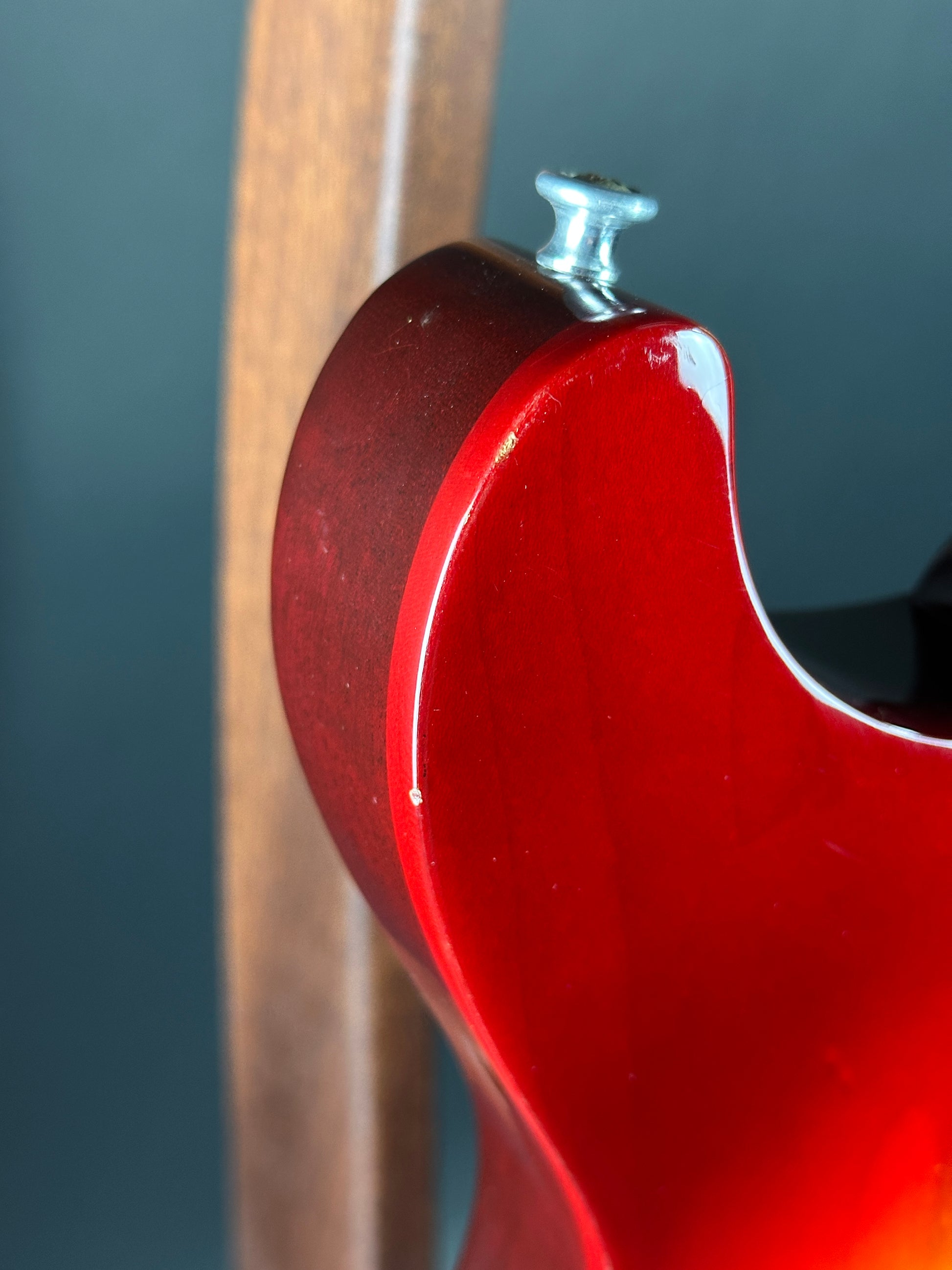 Wear on body of Used 1997 Gibson Les Paul Studio Double Cut Cherry Sunburst.