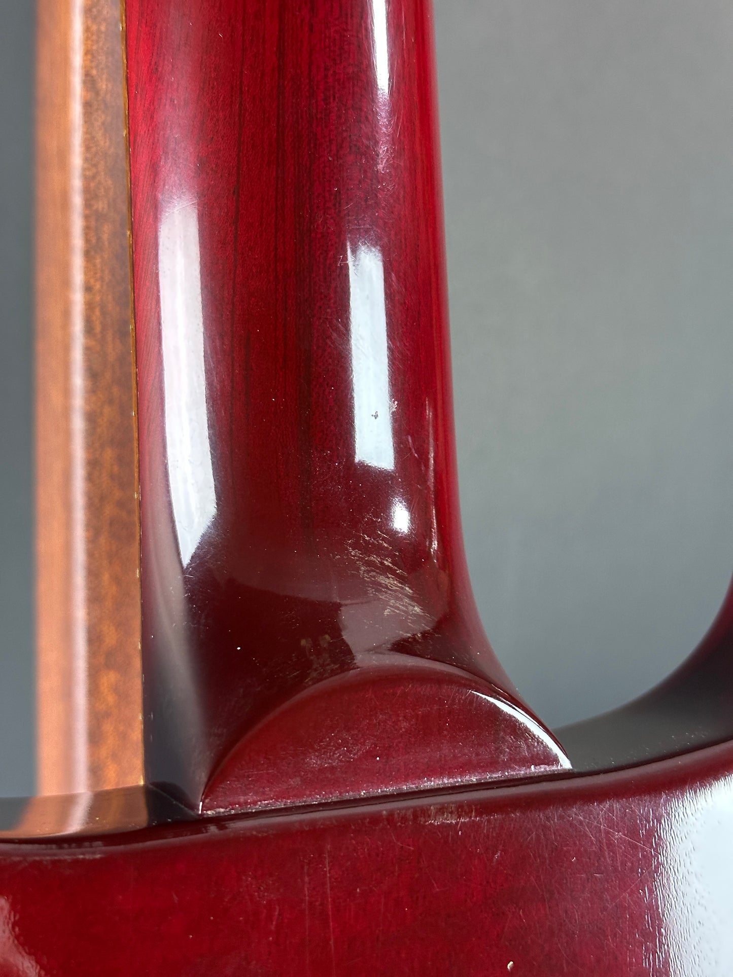 Wear on back of neck of Used 1997 Gibson Les Paul Studio Double Cut Cherry Sunburst.