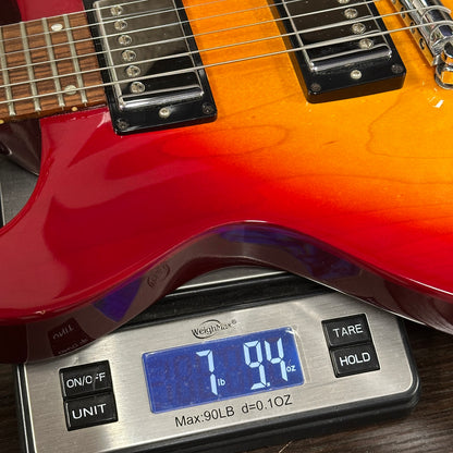 Guitar on a digital scale displaying weight