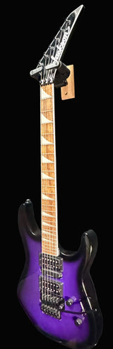 Purple electric guitar against a gray background