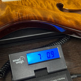 PRS Paul Reed Smith CE24 Semi-Hollow Quilt Black Amber on scale displaying weight.