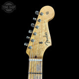 Close-up of a Fender guitar headstock on a black background