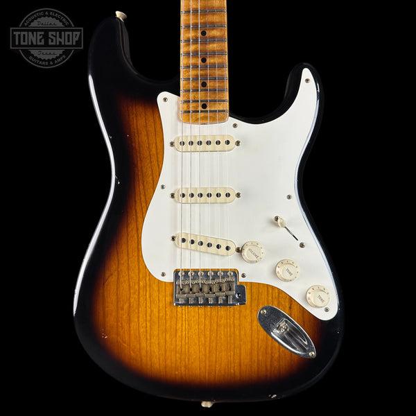 Electric guitar with sunburst finish on a black background, featuring 'Tone Shop' logo.