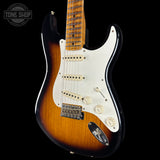 Fender Stratocaster guitar with a sunburst finish on a black background