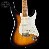 Electric guitar with a sunburst finish on a black background, featuring the Tone Shop logo.