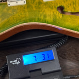 2024 PRS Paul Reed Smith CE24 Semi-Hollow Quilt Eriza Verde on scale displaying weight.
