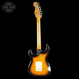 Electric guitar with a sunburst finish on a black background, featuring the Tone Shop logo.
