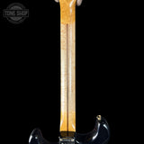 Guitar neck with a black body on a white background, featuring the Tone Shop logo.