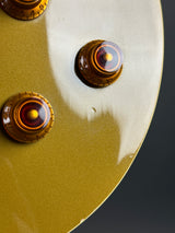 Ding near controls of Used 1996 Epiphone Les Paul Standard Gold Top.
