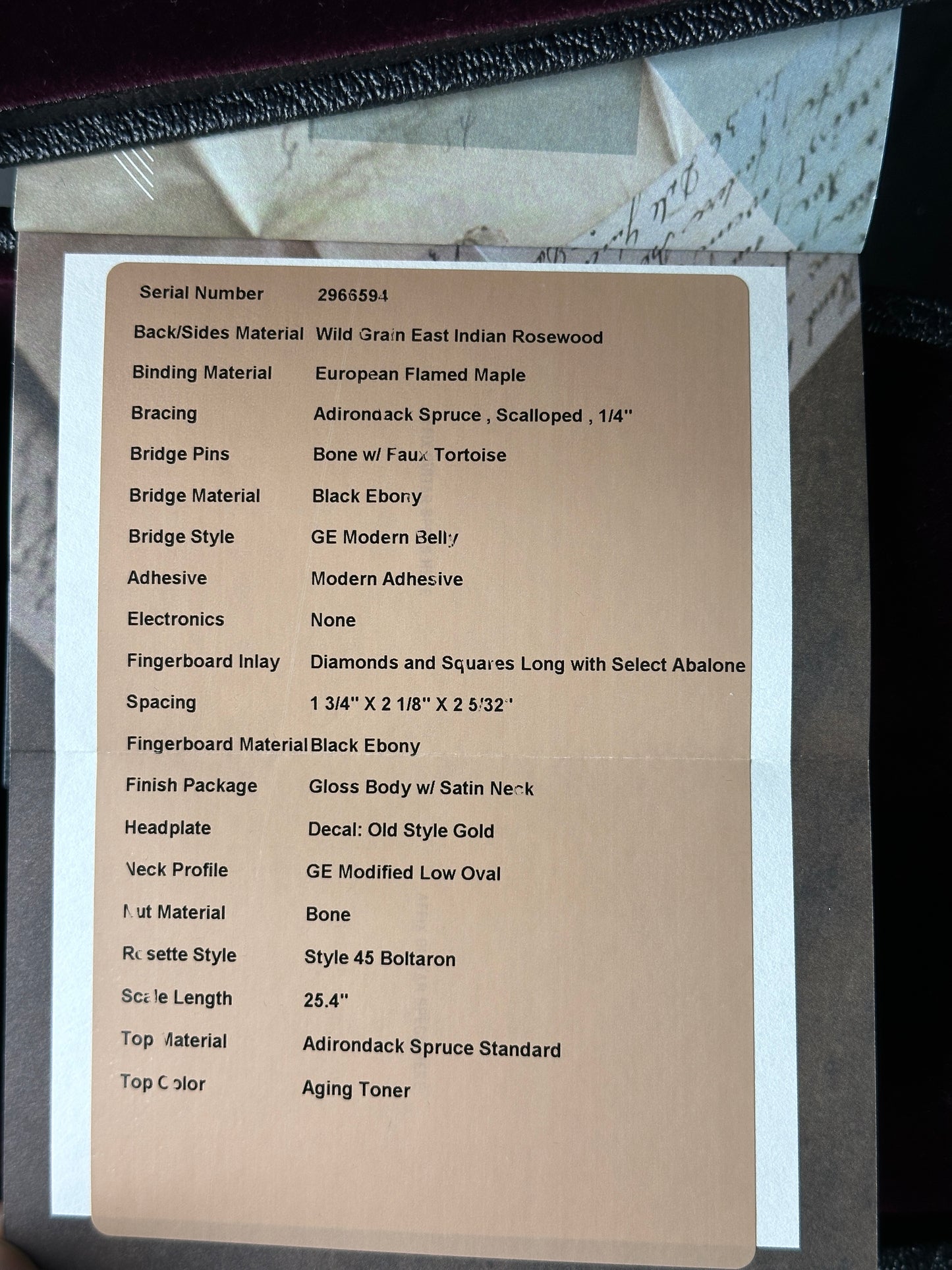 Spec sheet for Martin Custom Shop OM 14-Fret Wild Grain East Indian Rosewood.