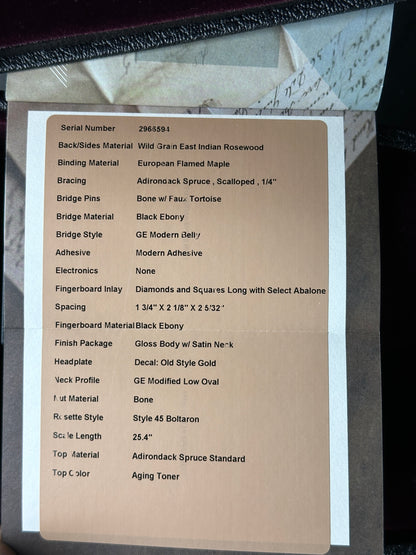 Spec sheet for Martin Custom Shop OM 14-Fret Wild Grain East Indian Rosewood.