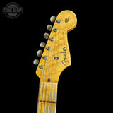 Close-up of a Fender guitar headstock on a black background