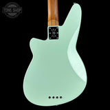 Light blue electric guitar with a dark background