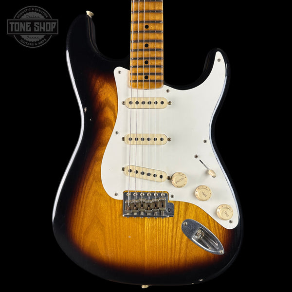 Fender Stratocaster guitar with a sunburst finish on a black background, featuring the Tone Shop logo.