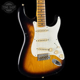 Fender Stratocaster guitar with a sunburst finish on a black background