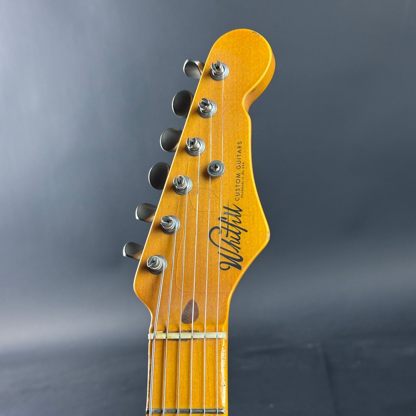 Headstock of Used 2020 Whitfill Custom Guitars S Style Hardtail Olympic White.