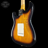 Electric guitar with a sunburst finish on a black background, featuring the Tone Shop logo.