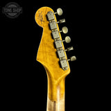Guitar headstock with tuning pegs on a black background, featuring the Tone Shop logo.