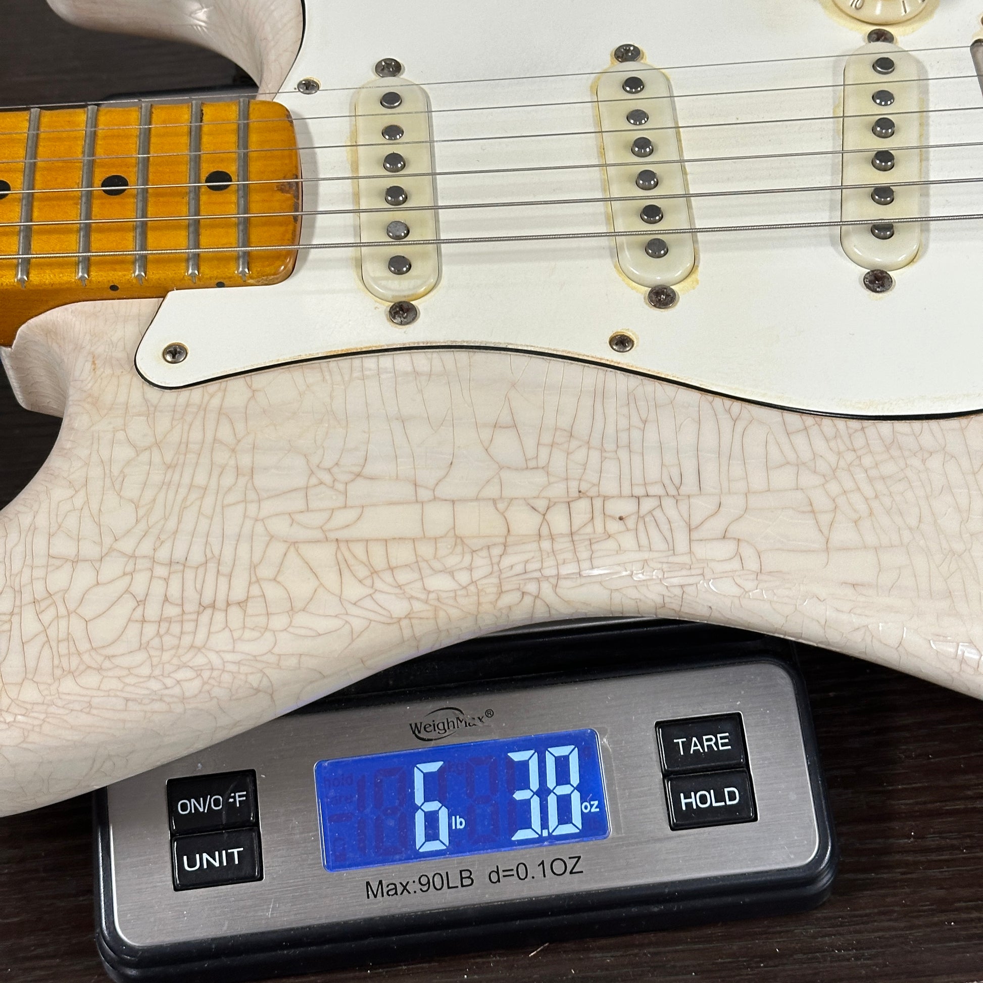 Used 2020 Whitfill Custom Guitars S Style Hardtail Olympic White on a scale displaying weight.