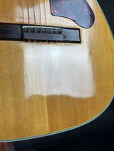 Close-up of a guitar's soundhole and bridge