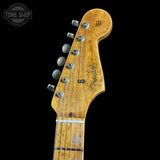 Close-up of a Fender guitar headstock on a black background