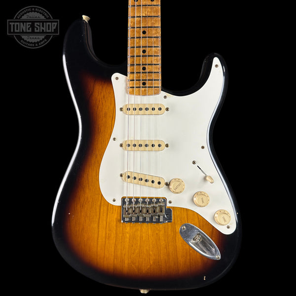 Fender Stratocaster guitar with a sunburst finish on a black background