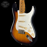 Fender Stratocaster guitar with a sunburst finish on a black background, featuring the Tone Shop logo.