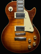 Brown electric guitar with a black background