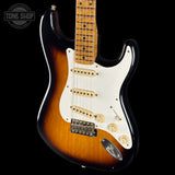 Electric guitar with sunburst finish on a black background, featuring 'Tone Shop' logo.