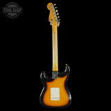 Electric guitar with sunburst finish on a black background, featuring 'Tone Shop' logo.