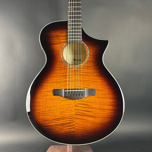 Acoustic guitar with a sunburst finish on a gray background
