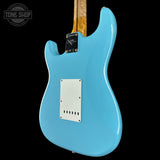 Blue electric guitar with a clear background