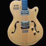 Electric guitar with a wooden body on a dark blue background
